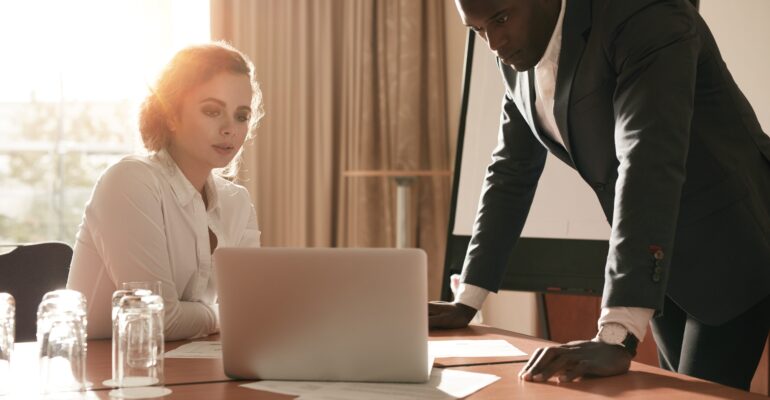 Businesspeople reviewing business plans.