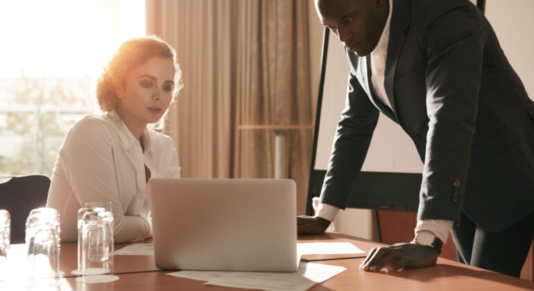 Businesspeople reviewing business plans.